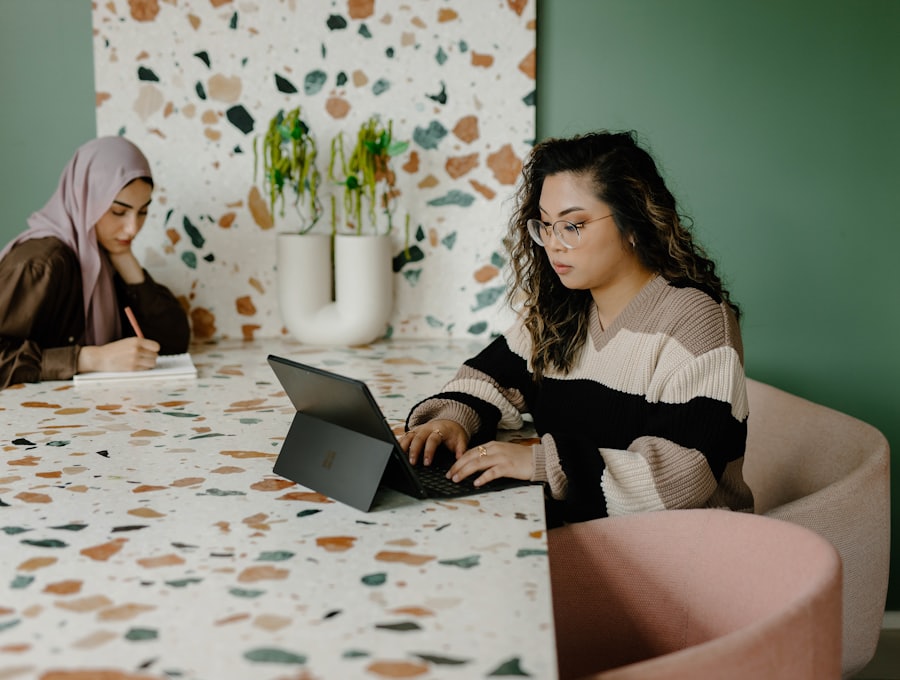 Two colleagues working at a laptop