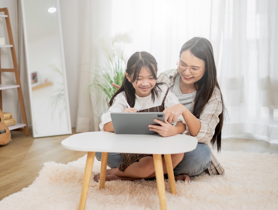 A mother and daughter using a tablet at home
